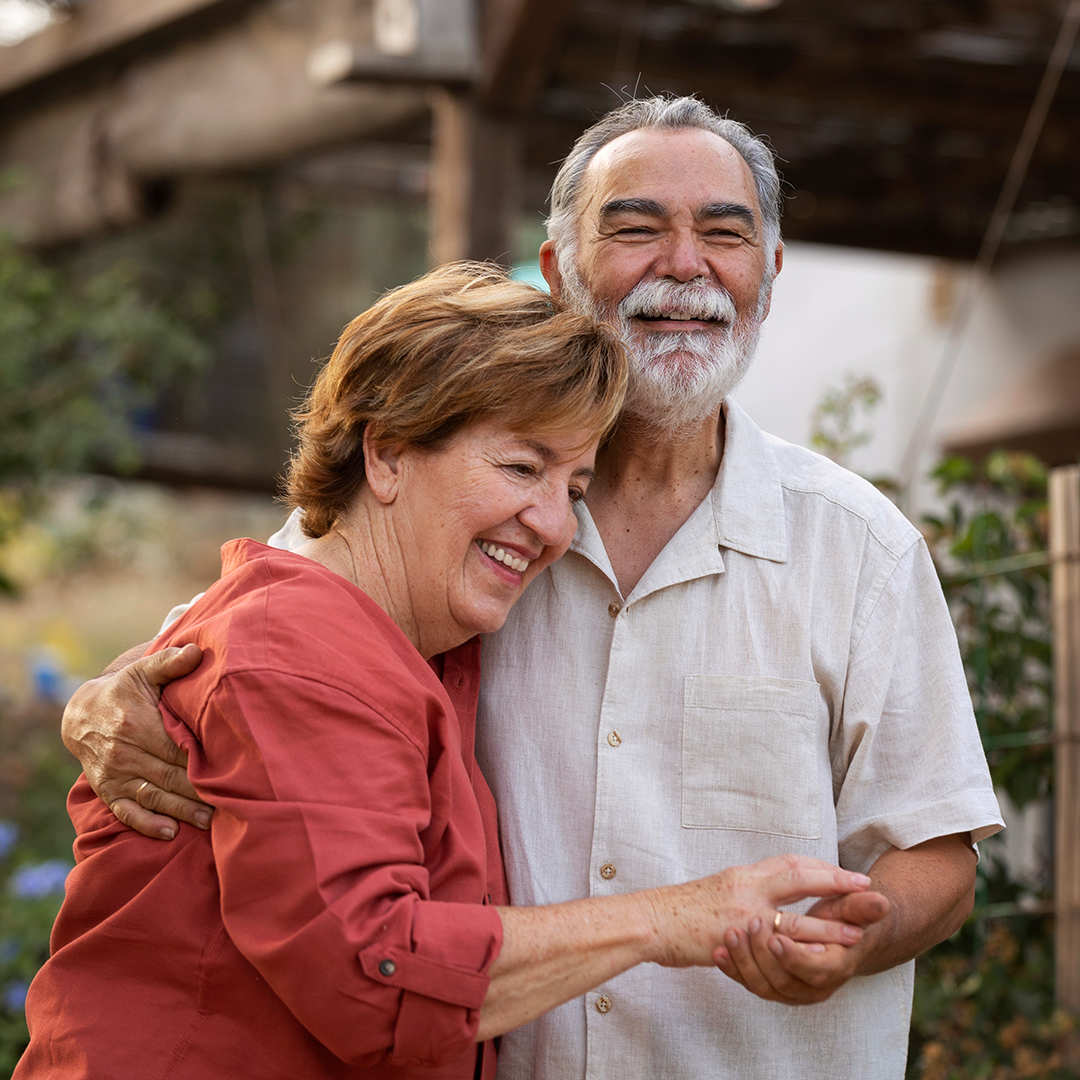 Older adults reviewing Medicare enrollment timing with licensed support